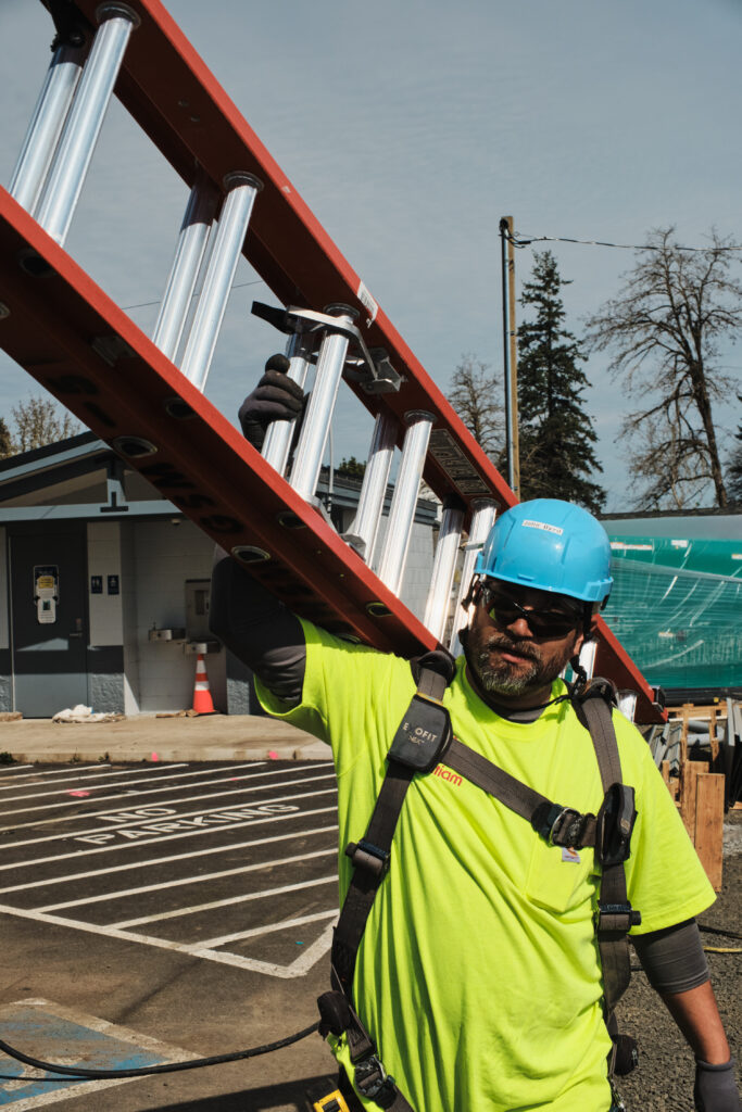 Close-up of ladder positioned for roof work