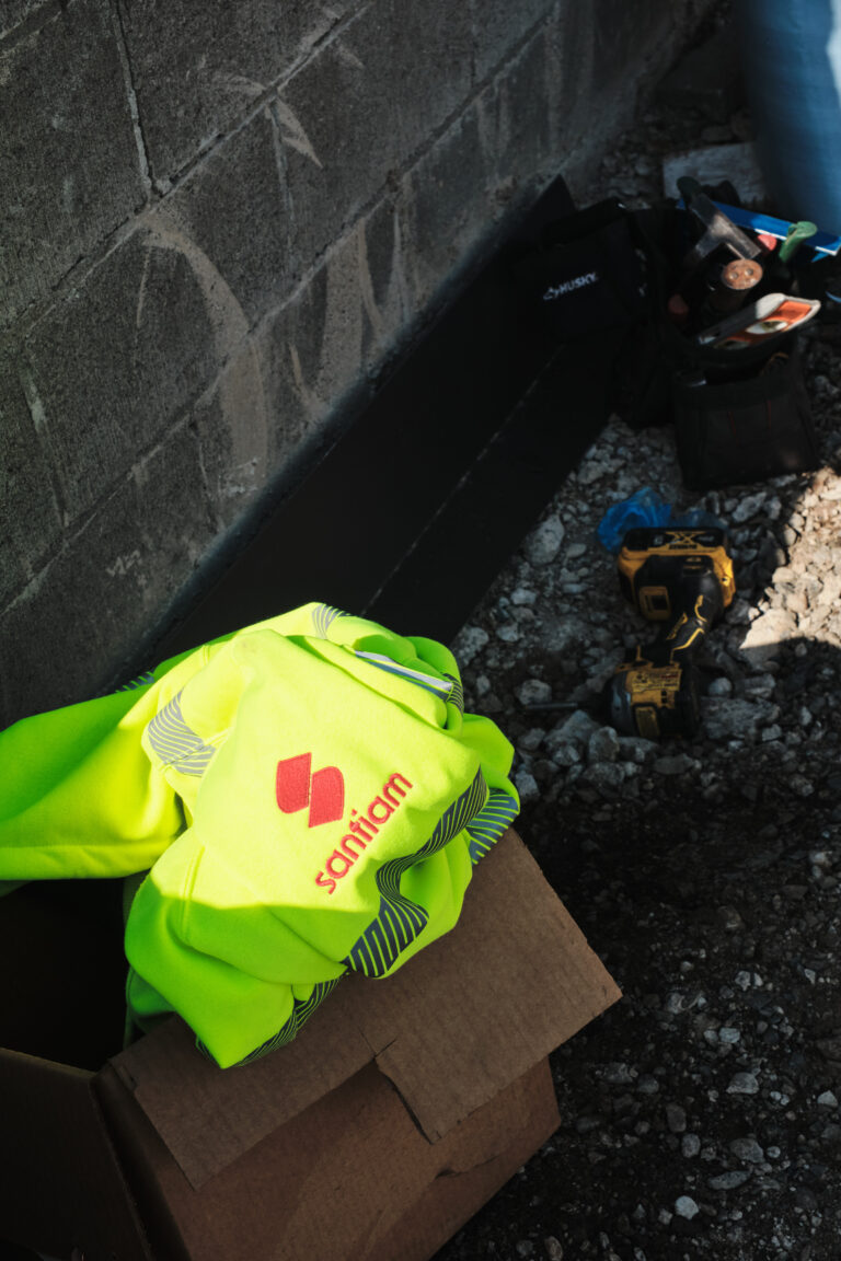 Tools and materials staged for exterior sheet metal work