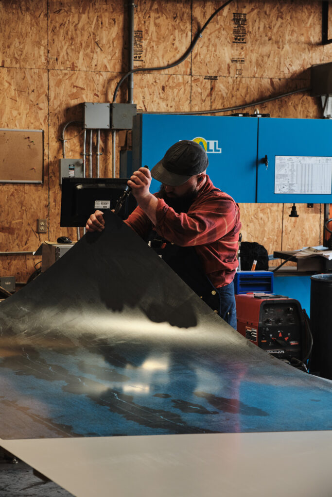 Cutting sheet metal on fabrication table