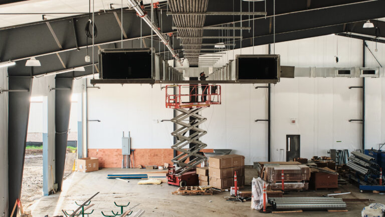 Installing overhead ductwork inside a commercial space
